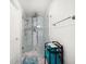 Modern bathroom featuring a glass shower and a steel towel rack above a stack of towels at 15 Avalon St # 303, Clearwater Beach, FL 33767