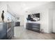 Bedroom features sleek gray dressers and a large wall mounted television at 15 Avalon St # 303, Clearwater Beach, FL 33767