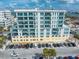 Modern condo building with blue glass balconies and convenient on-site parking at 15 Avalon St # 303, Clearwater Beach, FL 33767