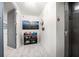 Hallway with elevator access and convenient storage rack for hats and accessories at 15 Avalon St # 303, Clearwater Beach, FL 33767