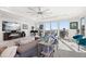 Bright living room with tile floors, grand windows with beach view, and a modern interior at 15 Avalon St # 303, Clearwater Beach, FL 33767