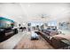 Expansive living room featuring a plush sectional, elegant decor, and panoramic ocean views at 15 Avalon St # 303, Clearwater Beach, FL 33767