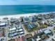 Aerial neighborhood shot with pickleball courts, the beach and local businesses at 15 Avalon St # 303, Clearwater Beach, FL 33767