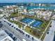 Scenic view of neighborhood with pickleball courts, playground, and street parking at 15 Avalon St # 303, Clearwater Beach, FL 33767