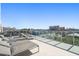 Spacious rooftop deck with modern loungers, offering expansive city views for ultimate relaxation at 15 Avalon St # 303, Clearwater Beach, FL 33767