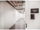 Hallway view of storage units with a door access system with Storage Units sign at 15 Avalon St # 303, Clearwater Beach, FL 33767