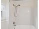 Tiled shower-tub combo with a shower head and temperature control at 1588 S Prospect Ave, Clearwater, FL 33756