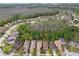 A high-altitude aerial shot of a community near a lake and golf course with beautiful surrounding trees at 16011 Bella Woods Dr, Tampa, FL 33647