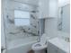 This is a well-lit bathroom with stylish tiling and modern fixtures at 1605 Crown St, Clearwater, FL 33755