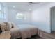 This is a bright bedroom with plenty of natural light and neutral decor at 1605 Crown St, Clearwater, FL 33755
