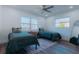 This is a bedroom with two twin beds and plush, patterned rugs at 1605 Crown St, Clearwater, FL 33755