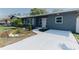 Charming home features new walkway, landscaping, and freshly painted exterior at 1605 Crown St, Clearwater, FL 33755