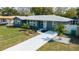 Charming home features new walkway, landscaping, and freshly painted exterior at 1605 Crown St, Clearwater, FL 33755