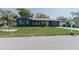 Single-story home featuring a well-manicured front yard, and a mailbox with the house number at 1605 Crown St, Clearwater, FL 33755