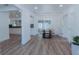 Bright dining area with wood floors, modern lighting, and neutral tones throughout at 1605 Crown St, Clearwater, FL 33755