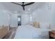 This is a light-filled main bedroom featuring recessed lights, a ceiling fan, and access to the ensuite at 1605 Crown St, Clearwater, FL 33755