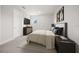 Cozy bedroom with a TV and beige carpet flooring at 2011 Belleair Rd, Clearwater, FL 33764