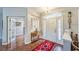Inviting foyer with hardwood floors, decorative lighting, and stylish decor at 2926 Spring Hammock Dr, Plant City, FL 33566