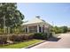 Charming white and gray gatehouse provides security and aesthetic appeal to the community at 2926 Spring Hammock Dr, Plant City, FL 33566