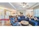 Spacious living room features hardwood floors, modern decor, and natural light at 2926 Spring Hammock Dr, Plant City, FL 33566