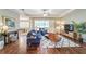 Open-concept living area with hardwood floors and backyard views at 2926 Spring Hammock Dr, Plant City, FL 33566