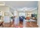 Bright living room features hardwood floors, tray ceilings, and comfortable seating at 2926 Spring Hammock Dr, Plant City, FL 33566