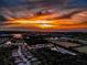 Breathtaking aerial view of a neighborhood at sunset, with vibrant colors and a scenic coastal backdrop at 309 Royal Bonnet Dr, Apollo Beach, FL 33572