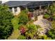 An aerial view of the backyard featuring well maintained landscaping and a screened in patio at 309 Royal Bonnet Dr, Apollo Beach, FL 33572