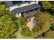 Lush backyard featuring a screened lanai, well maintained landscaping and brick paver path at 309 Royal Bonnet Dr, Apollo Beach, FL 33572