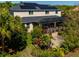 An aerial view of the home with a screened in patio and solar panels at 309 Royal Bonnet Dr, Apollo Beach, FL 33572