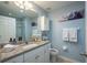 Well-lit bathroom with a granite countertop, modern fixtures, and fresh towels at 309 Royal Bonnet Dr, Apollo Beach, FL 33572