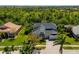 Charming home with a manicured front yard and mature palm trees at 309 Royal Bonnet Dr, Apollo Beach, FL 33572