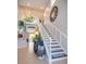 Inviting foyer boasts soaring ceilings, a striking staircase, and stylish decor, creating a grand entrance at 309 Royal Bonnet Dr, Apollo Beach, FL 33572