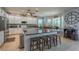 A spacious kitchen with granite countertops, an island, and modern stainless steel appliances at 309 Royal Bonnet Dr, Apollo Beach, FL 33572