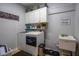 Functional laundry room with modern appliances, white cabinets, and plenty of storage space at 309 Royal Bonnet Dr, Apollo Beach, FL 33572
