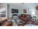 Inviting living room featuring a comfortable leather sofa and a flat-screen TV for entertainment at 309 Royal Bonnet Dr, Apollo Beach, FL 33572
