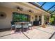 Covered patio featuring two ceiling fans, a dining table with seating, and a view of the backyard at 309 Royal Bonnet Dr, Apollo Beach, FL 33572