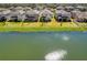 An aerial shot showcasing backyards on waterfront property and the surrounding community at 3139 Marine Grass Dr, Wimauma, FL 33598