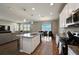 Open concept kitchen and living area with modern appliances and water views at 3139 Marine Grass Dr, Wimauma, FL 33598