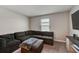 Cozy living area with a large sectional and view of the backyard at 3139 Marine Grass Dr, Wimauma, FL 33598