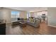 Open floor plan features a spacious living room, dining area, and modern kitchen at 3139 Marine Grass Dr, Wimauma, FL 33598