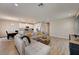 Open floor plan showcases a living room, dining area, and modern kitchen at 3139 Marine Grass Dr, Wimauma, FL 33598