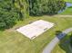 Aerial view of a pristine shuffleboard court surrounded by lush greenery at 3701 Teeside Dr # 3701, New Port Richey, FL 34655