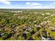 Panoramic aerial view of a neighborhood with lush trees and community features at 37420 Meridian Ave, Dade City, FL 33525