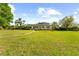 Charming one-story home with expansive front lawn at 37420 Meridian Ave, Dade City, FL 33525