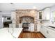 Modern kitchen featuring a brick oven hood, stainless steel appliances, custom cabinetry and counter tops at 37420 Meridian Ave, Dade City, FL 33525