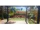 Backyard pergola overlooking a lush, green lawn ready for entertaining or relaxing at 409 S Arrawana Ave, Tampa, FL 33609