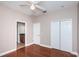 A modest room features wood floors, neutral walls, and dual closets at 409 S Arrawana Ave, Tampa, FL 33609