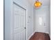This home entryway features hardwood floors and a decorative front door with an oval window at 409 S Arrawana Ave, Tampa, FL 33609