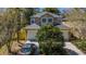 Charming two-story home with a two-car garage and beautifully landscaped front yard at 409 S Arrawana Ave, Tampa, FL 33609